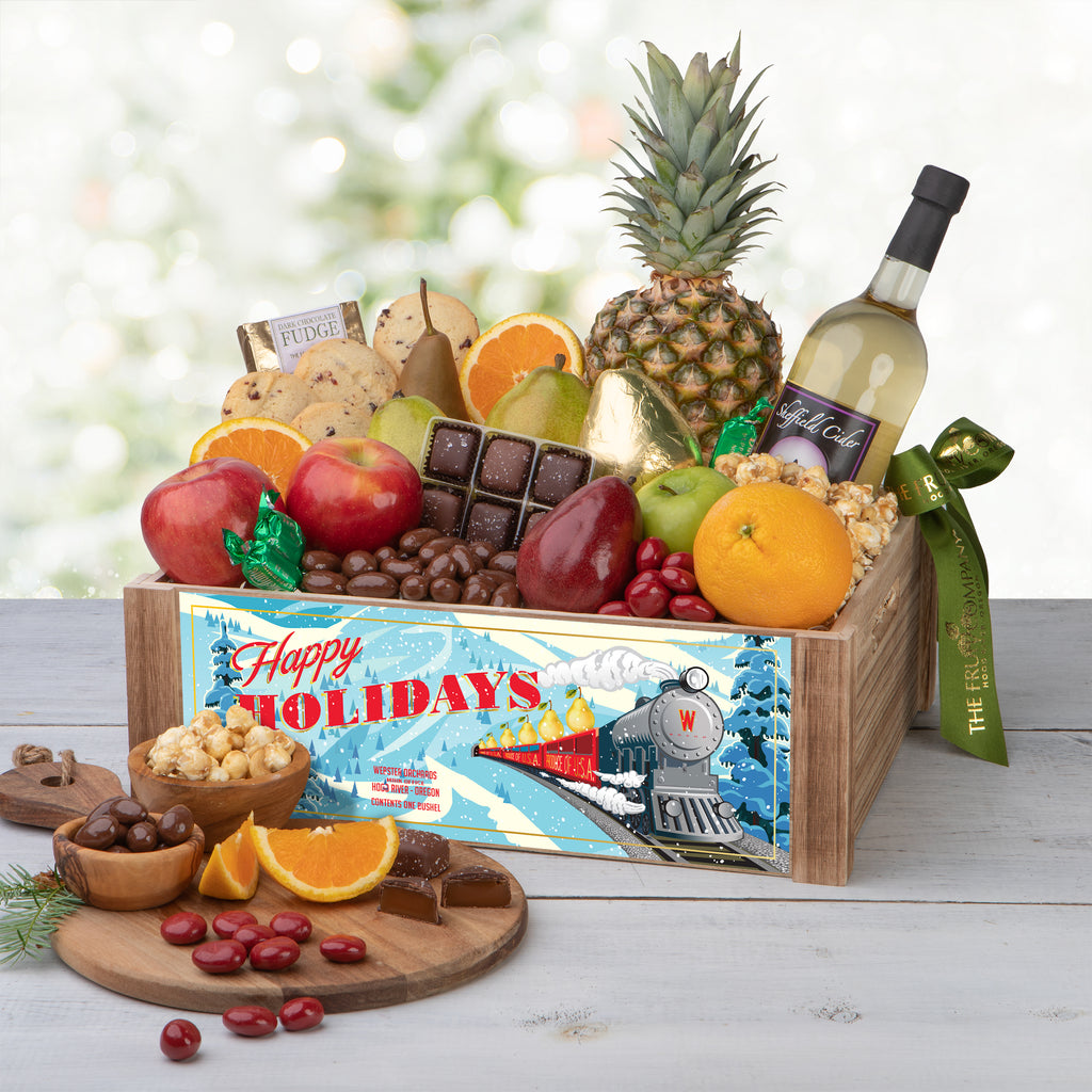 Deluxe Sleigh Ride Gift Crate and all of its content Caramel popcorn and candied cherries Fruits, Sheffield Cider, candies, and chocolate Sheffield Cider, pineapple, and a gold foiled pear Orange, apples,pears, and caramel popcorn Apples and chocolates in the gift crate Open box content of the sleigh ride gift crate